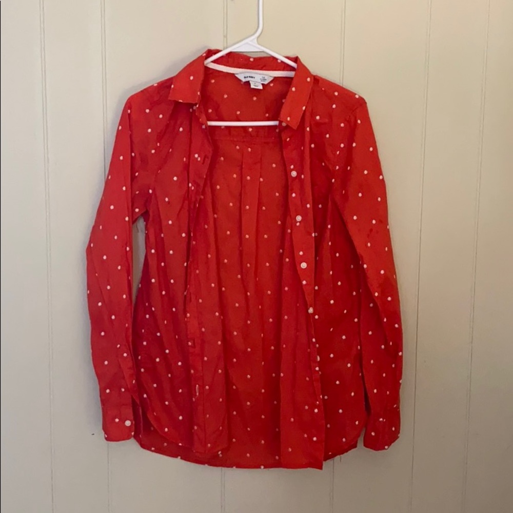 Red button up shirt with white flowers.